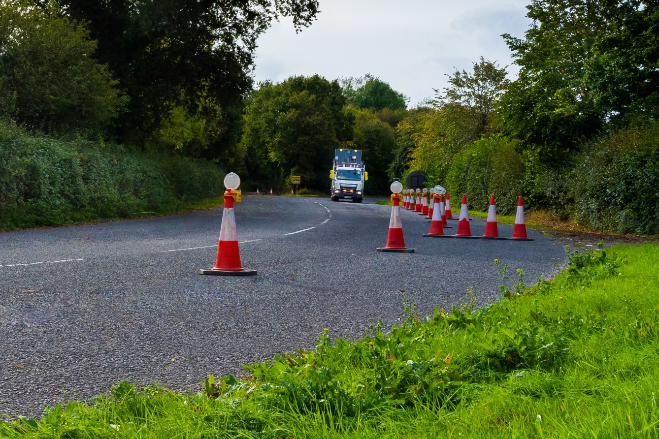 temporary traffic cones lining country road - Core Highways
